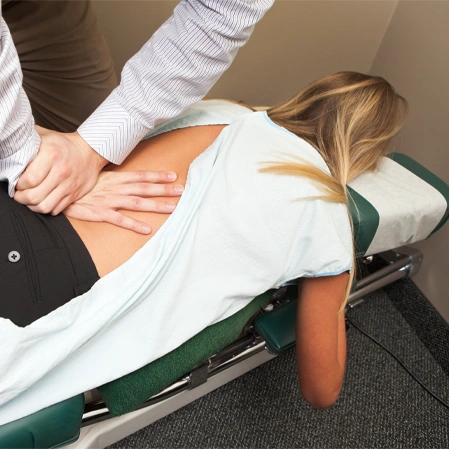 Chiropractic Merrill WI Woman Receiving Adjustment