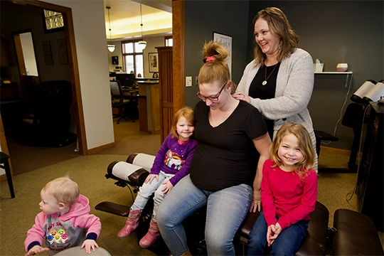 Chiropractor Merrill WI Carri Kennedy With Pregnant Patient